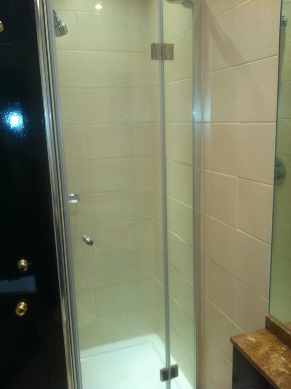 Frameless glass shower enclosure with chrome fittings in Bicester