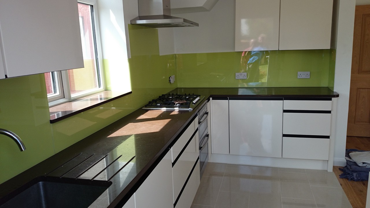 Lime green glass kitchen splashback installed by Bicester glaziers